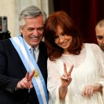 Argentina's President Alberto Fernandez holds the symbolic leader's staff after he was sworn in as Argentina's next president, in Buenos Aires